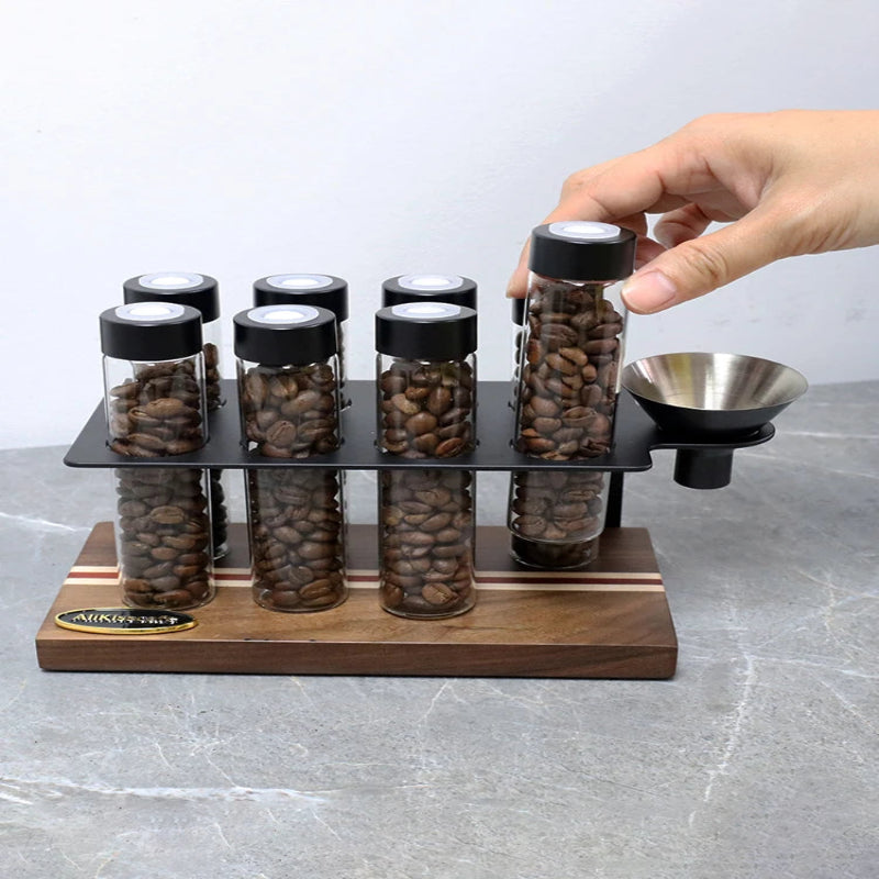 Coffee bean storage tubes for organized single-dose espresso preparation.