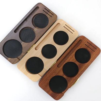 Wooden espresso accessory for organized countertop preparation.