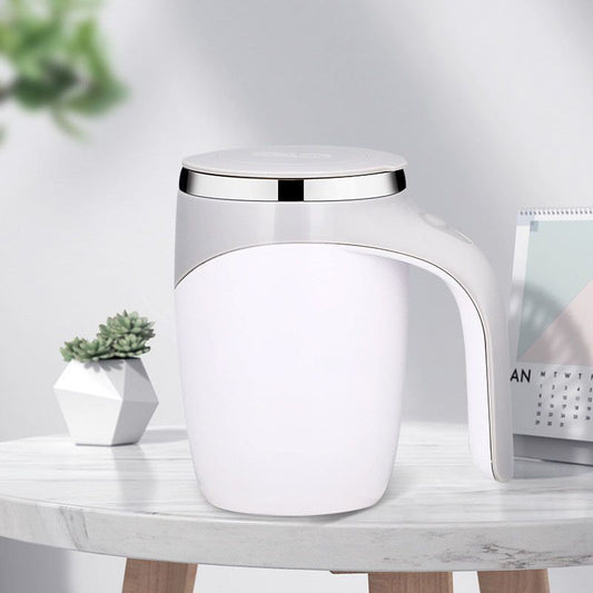 White HOMEFISH self-stirring mug displayed on an office desk.