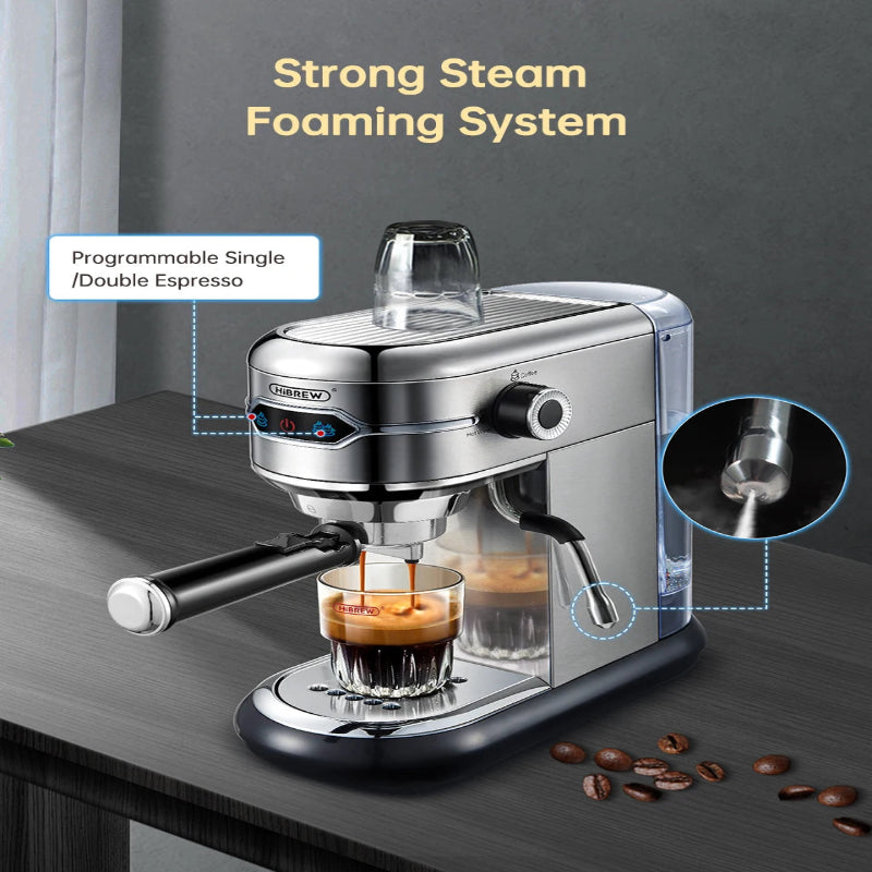Espresso machine with strong steam foaming system on a dark surface with coffee beans.