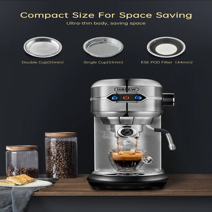 Coffee machine with a glass cup of coffee on a wooden surface, surrounded by jars and a towel.