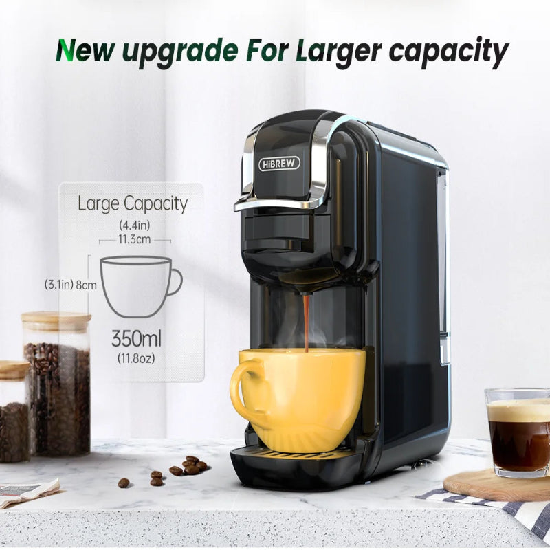 Coffee machine with a yellow cup and text highlighting larger capacity on a white background