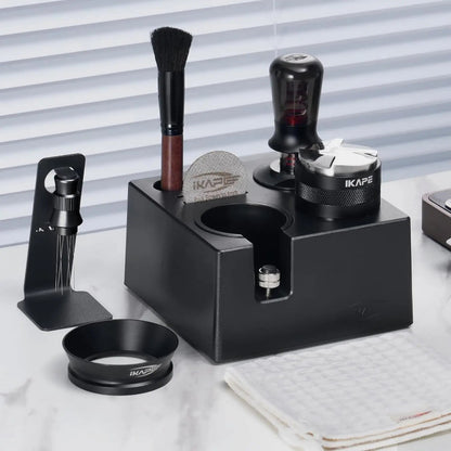 Black grooming station with various tools on a white surface