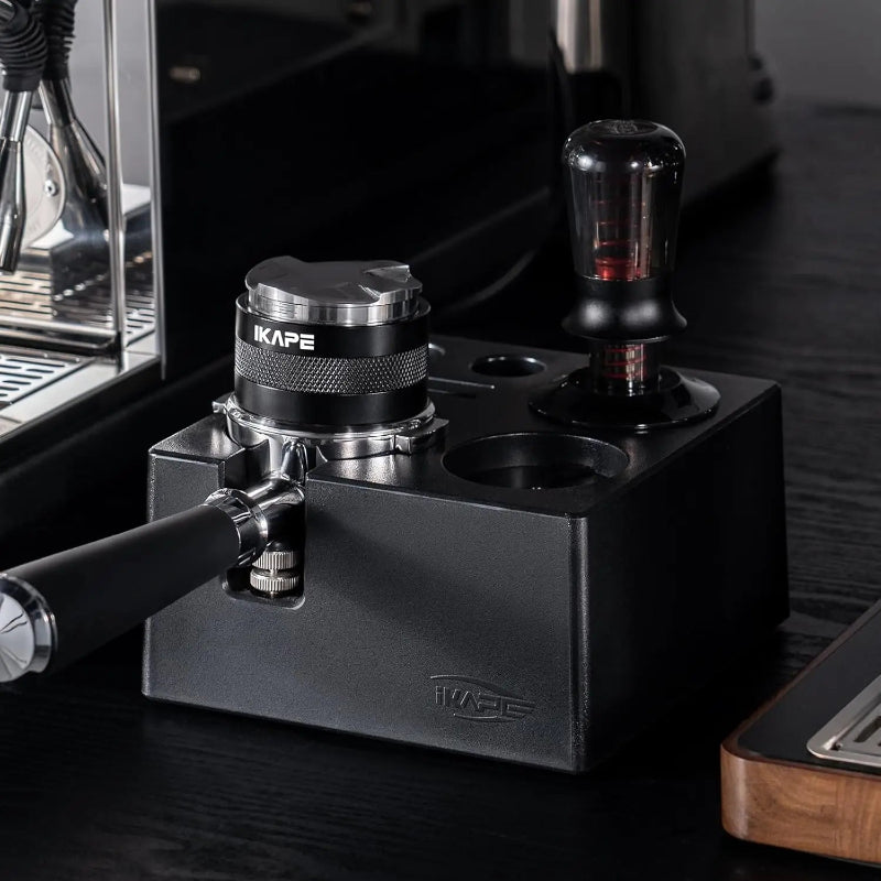 Premium espresso preparation tools with a magnetic dosing funnel.