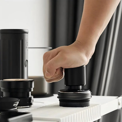 Front view of the IKAPE constant-pressure espresso tamper.