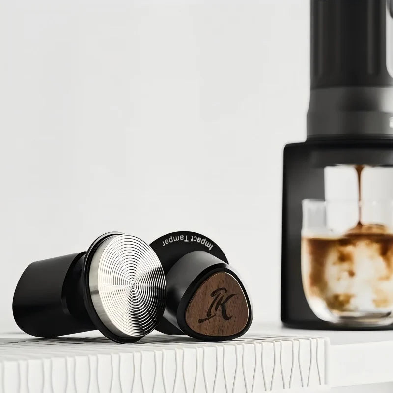 The IKAPE coffee tamper has interchangeable spring pressure settings.