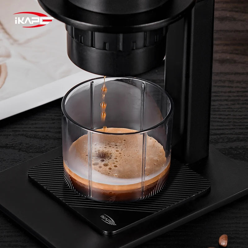 IKAPE manual coffee brewer for portable espresso preparation.
