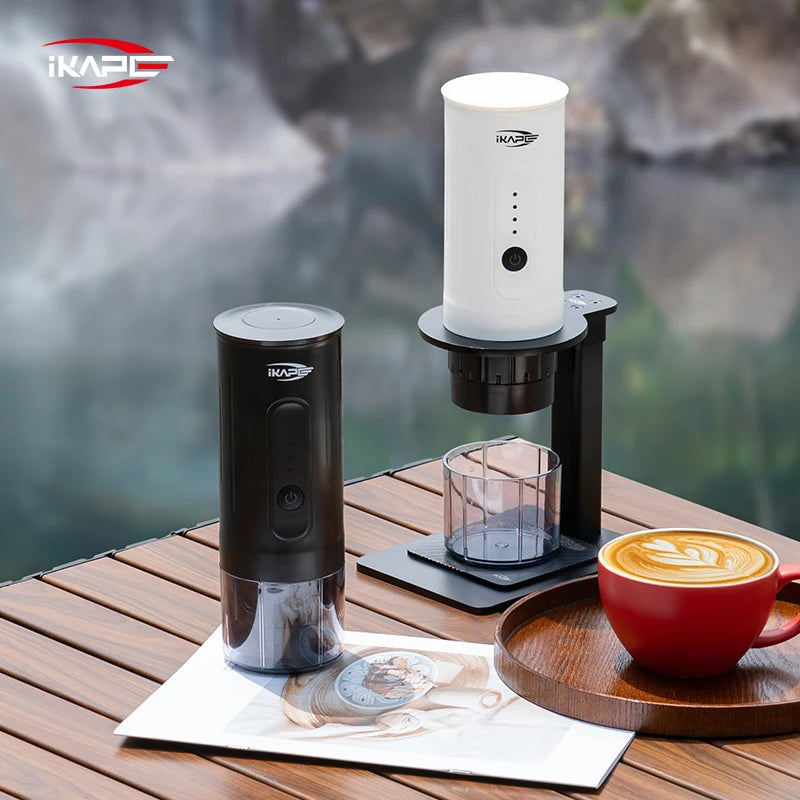 iKapo coffee maker with a cup of coffee on a wooden surface by a body of water.