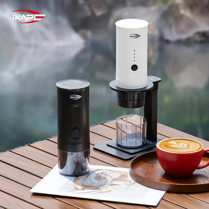 iKapo coffee maker with a cup of coffee on a wooden surface by a body of water.