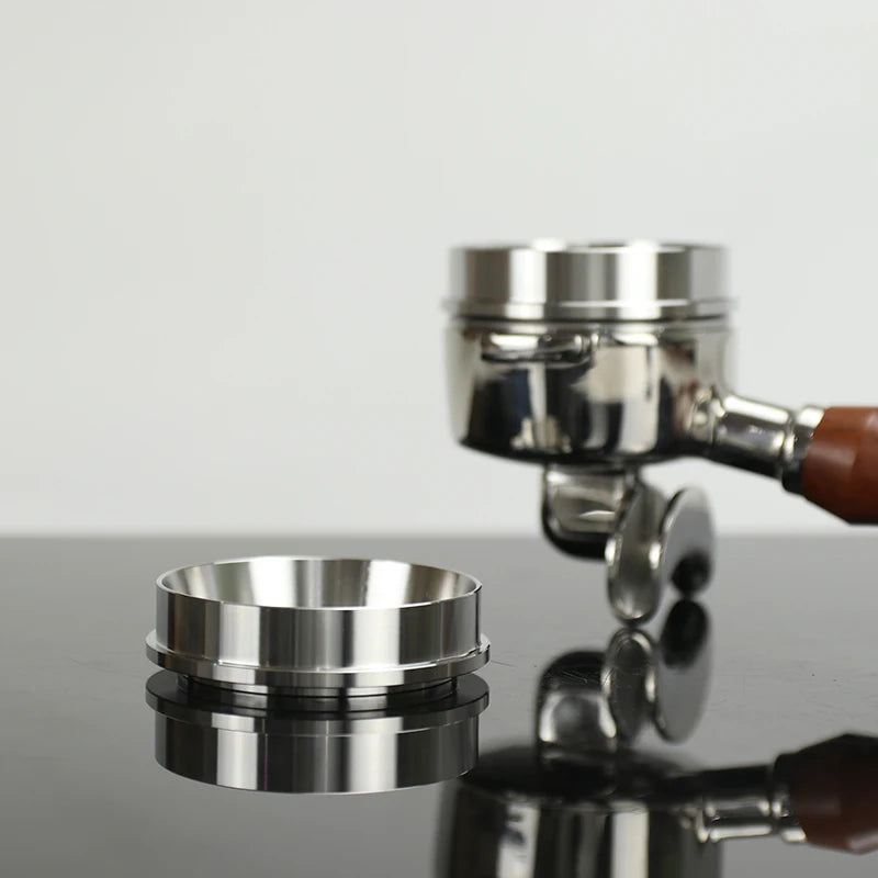 Coffee espresso machine group on a reflective surface with a light gray background