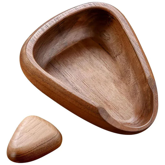 Wooden dish and stone on a white background